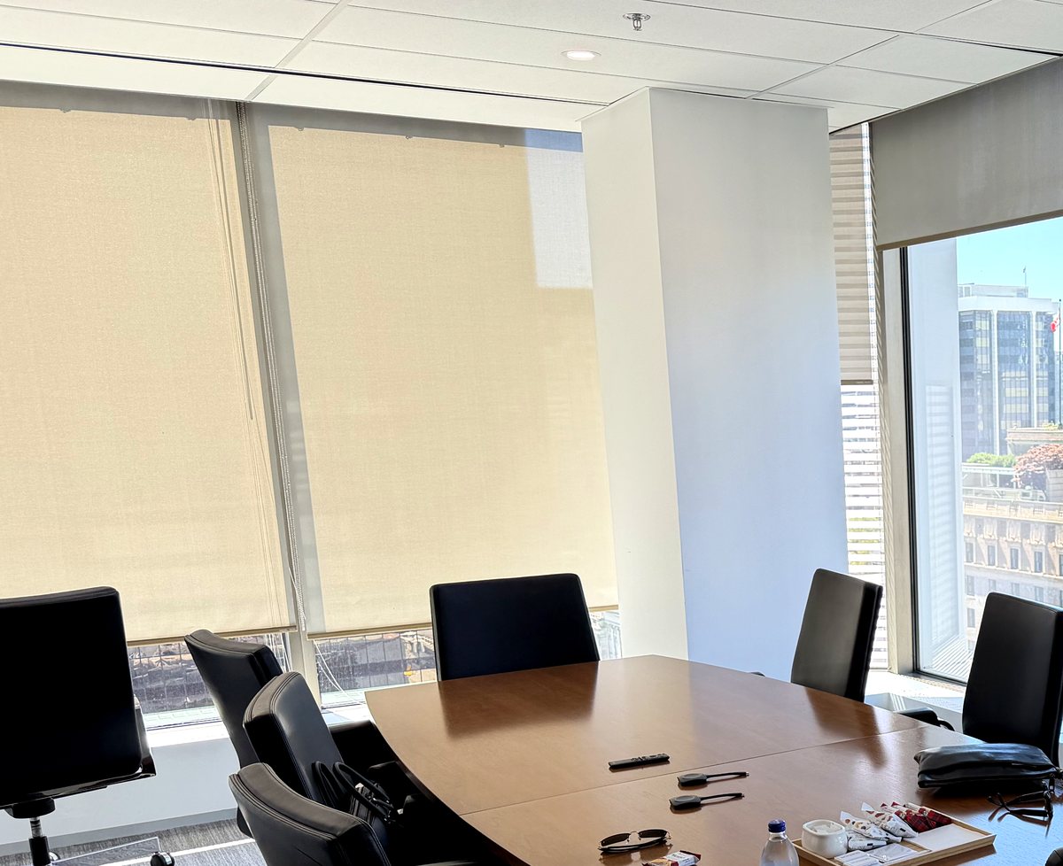 Boardroom at Adamant Holding's corporate headquarters in downtown Vancouver, with floor-to-ceiling windows overlooking the city.